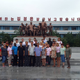 Students and teachers from the North Korean Songdowon summer camp pose in front of a sculpture in 2015.